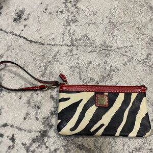 Dooney & Bourke Zebra Pattern Wristlet with Red Accents